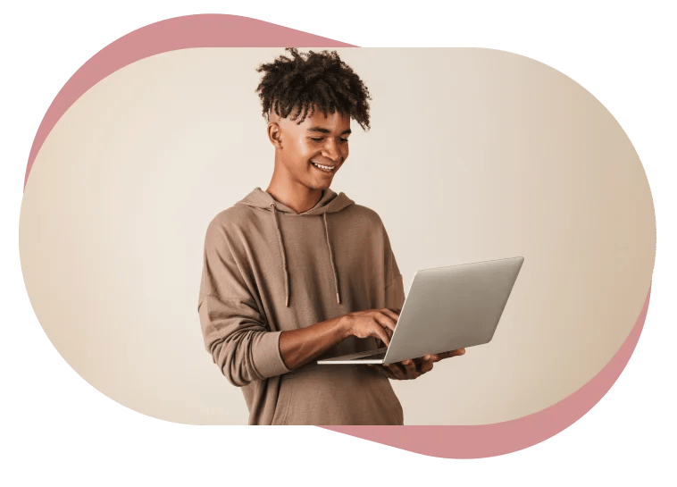 teenager holding laptop